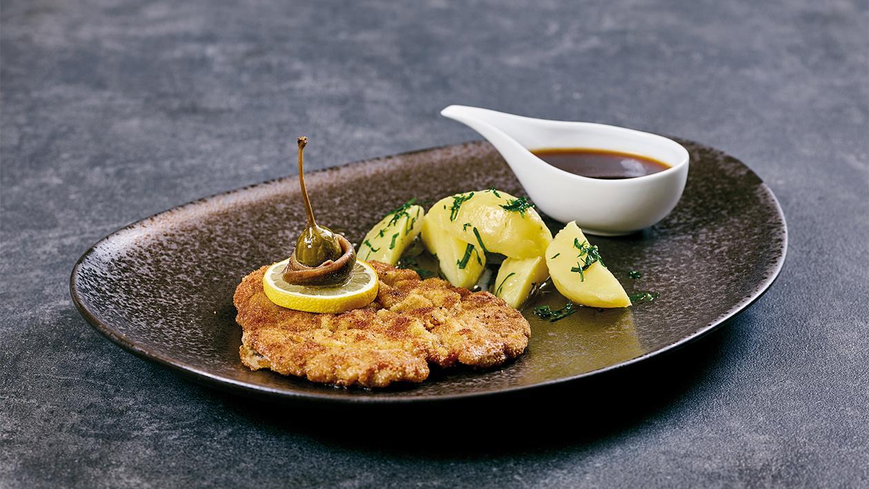 Schweineschnitzel "Wiener Art" mit Petersilien Kartoffeln Schweineschnitzel "Wiener Art" mit Petersilien Kartoffeln