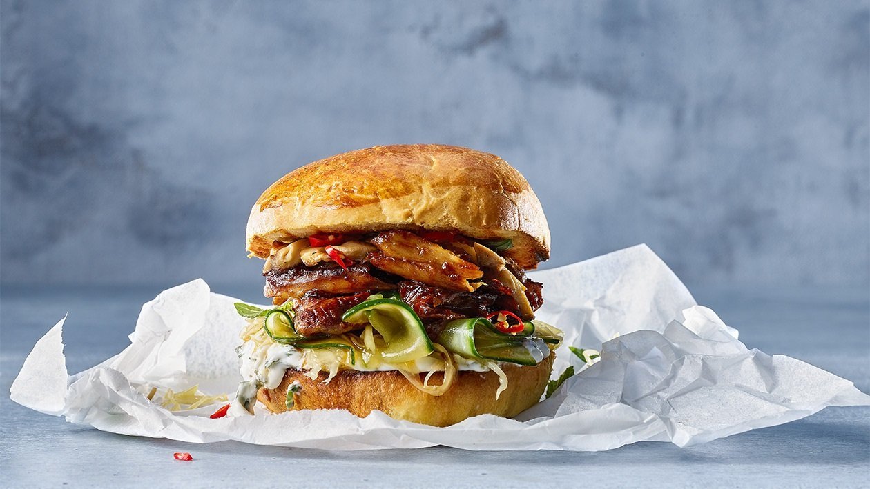 Teriyaki glazed Chicken Burger with cucmber pickle and ginger mayo