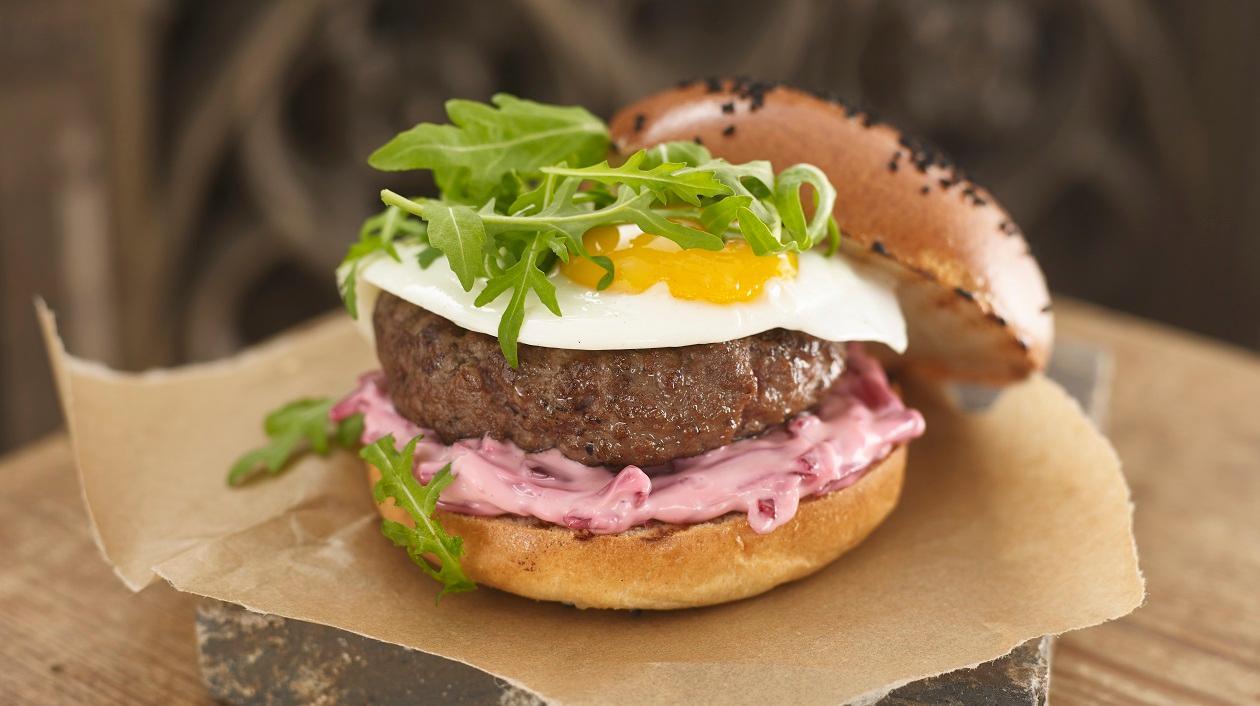 Australian burger with fried egg, beetroot and rocket Australian burger with fried egg, beetroot and rocket