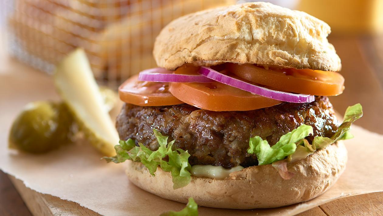 Beef burger in a gluten free bread roll Beef burger in a gluten free bread roll
