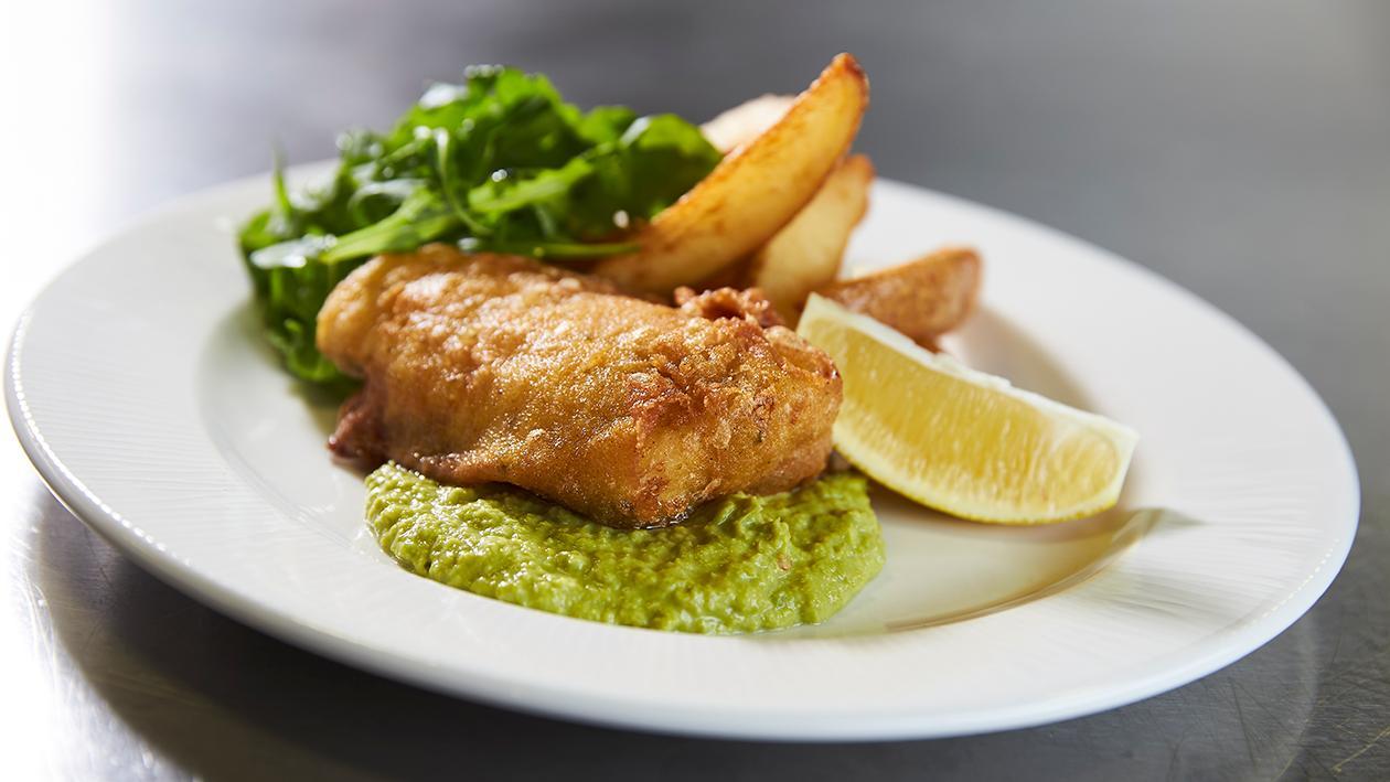 Spiced fish and chips with yoghurt pea puree Spiced fish and chips with yoghurt pea puree