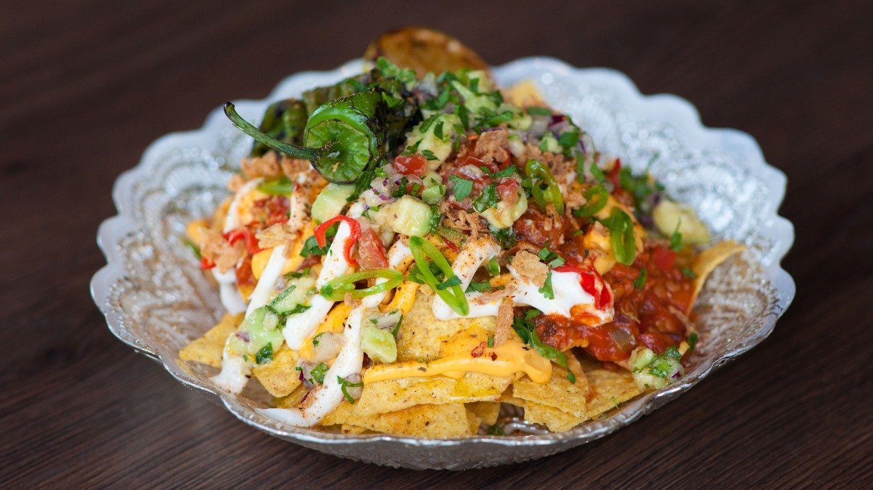 Tortilla Chips and lentil ragout with faux ‘cheese’ vegan mayo and charred poblano pepper Tortilla Chips and lentil ragout with faux ‘cheese’ vegan mayo and charred poblano pepper