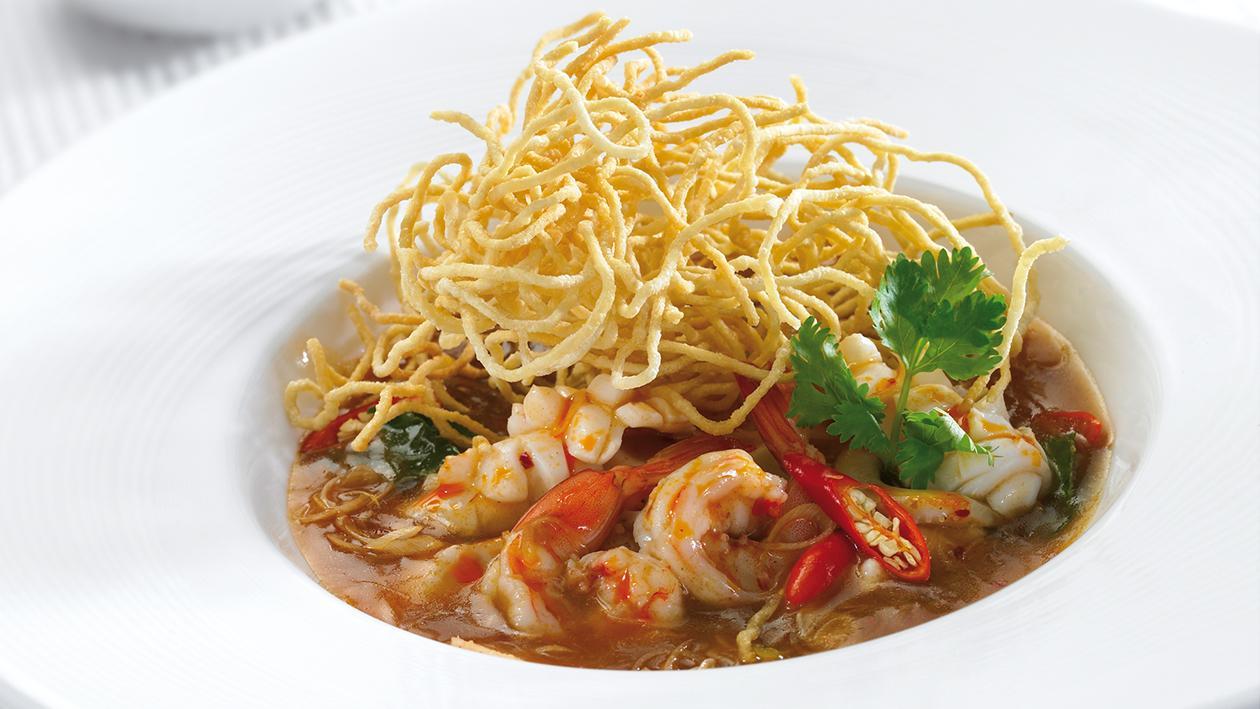 Seafood fried noodle with sour prawn soup Seafood fried noodle with sour prawn soup
