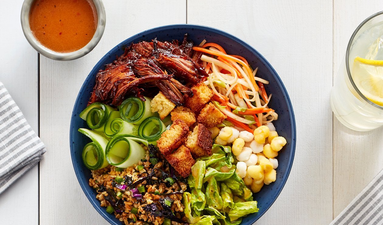 BBQ Pulled Pork Bowl with Hominy, Smoky Peach Kimchi Slaw and Cornbread Croutons – recipe BBQ Pulled Pork Bowl with Hominy, Smoky Peach Kimchi Slaw and Cornbread Croutons – recipe