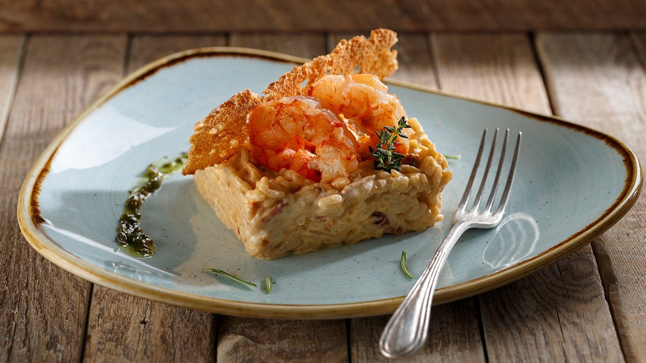 Risotto de tomate seco, albahaca fresca y gambas Risotto de tomate seco, albahaca fresca y gambas