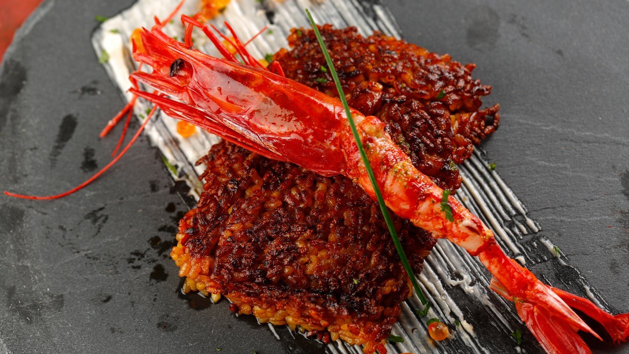 Socarrat de arroz abanda con carabineros Socarrat de arroz abanda con carabineros
