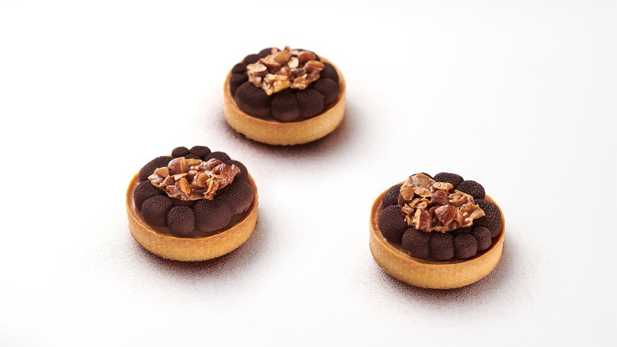 Tartelletta con mousse pralinata e croccante alle mandorle – Ricetta Tartelletta con mousse pralinata e croccante alle mandorle – Ricetta